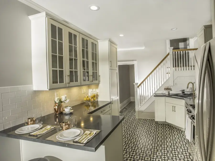 Classic White Kitchen with Patterned Tile Flooring